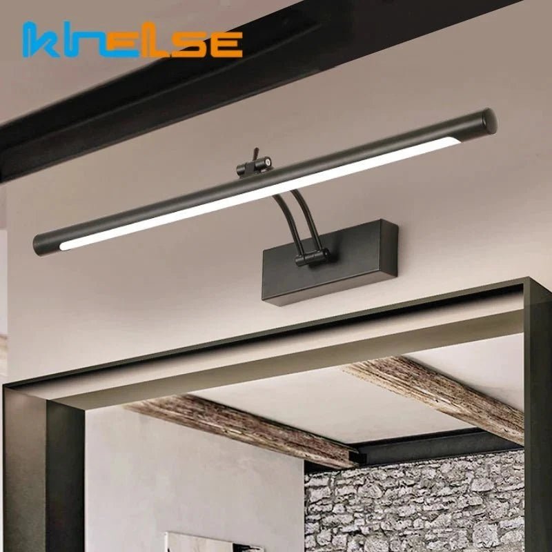Modern LED vanity wall lamp beside a bathroom mirror