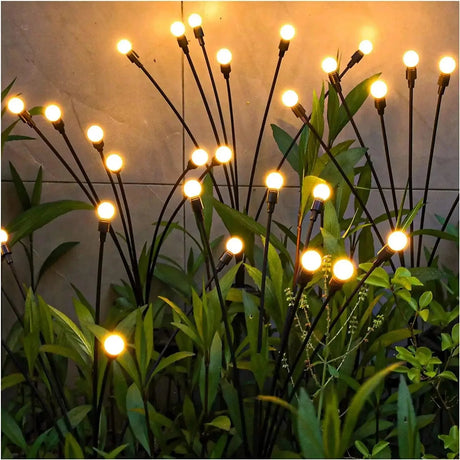 Solar landscape lighting glowing along an outdoor path