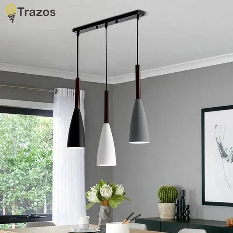 Scandinavian-style pendant lights sized for a dining table